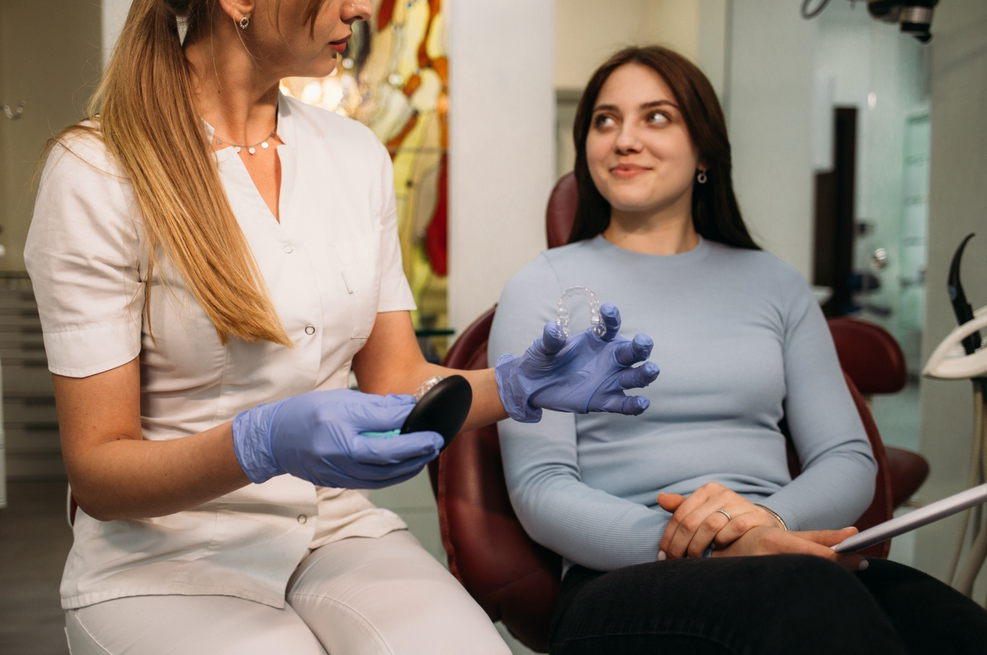 A clinician scanning a patient in the chair